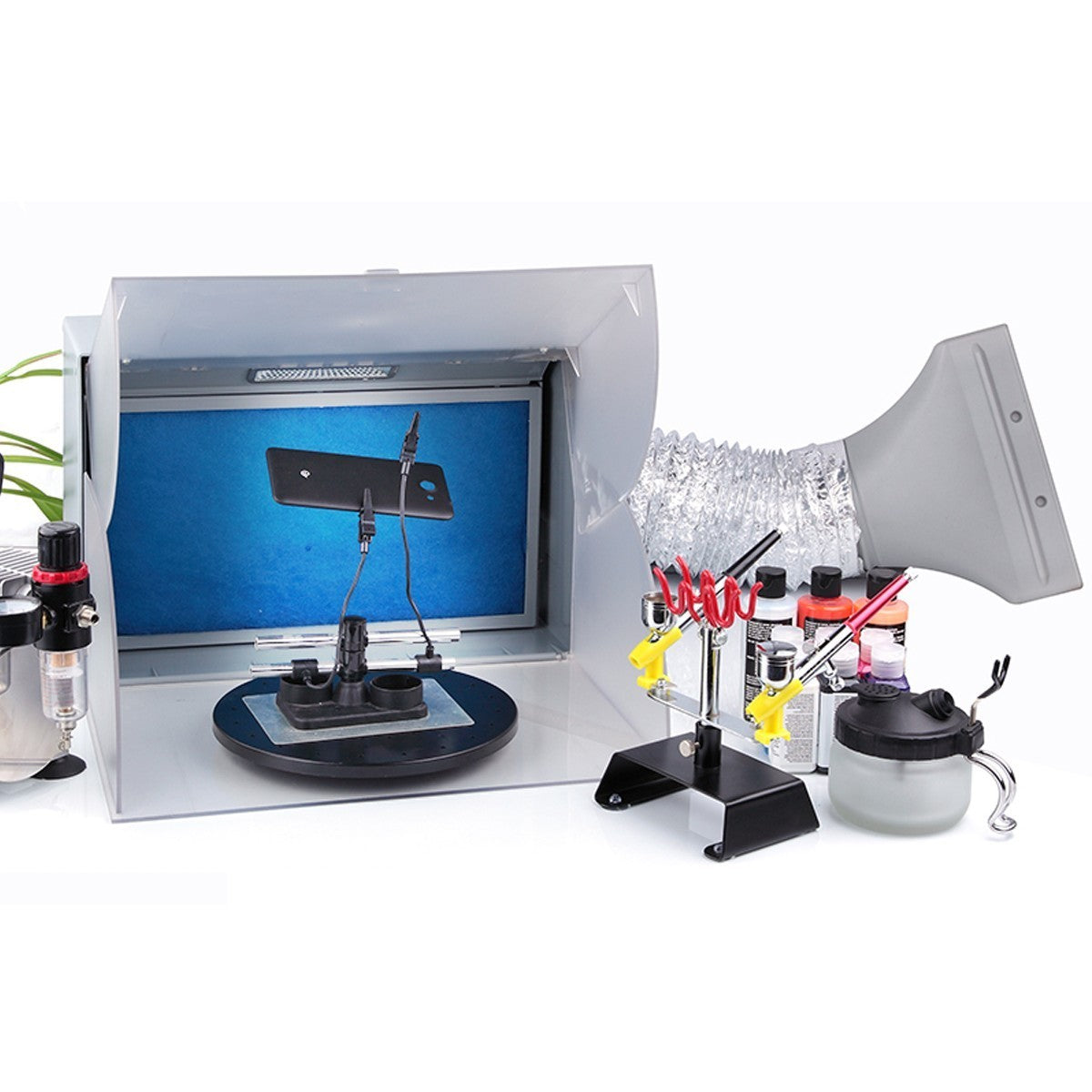 Cabine BD-512A en atelier avec aérographe et support
